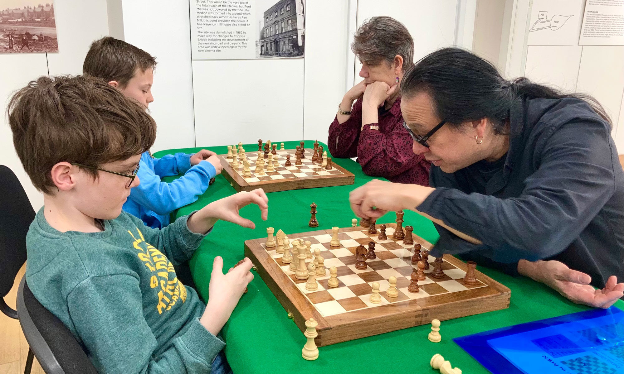Adult and child playing chess